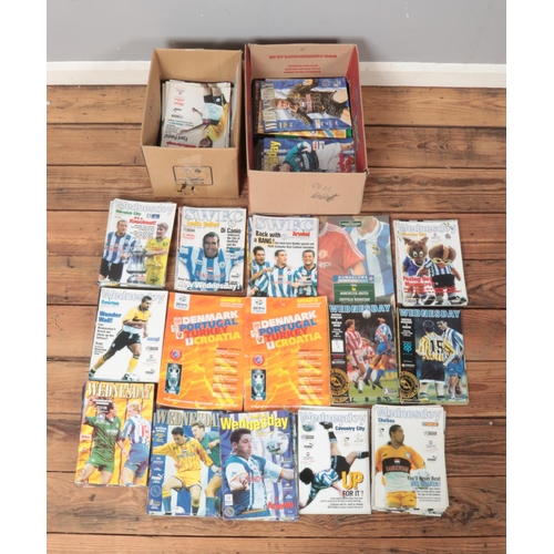 316 - Two of containing a large quantity of 1990s Sheffield Wednesday football programmes.