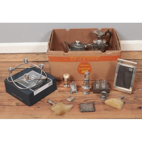 343 - A box of assorted silver plate and pewter items. To include boxed Georg Jensen season candlestick, s... 