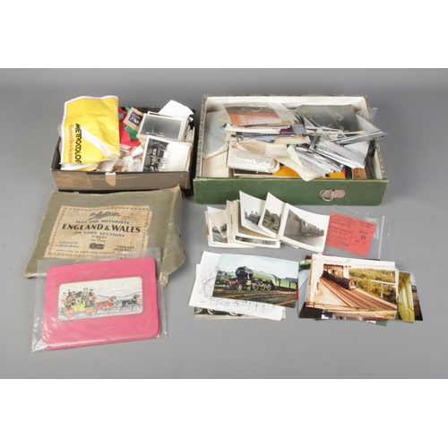 352 - Two boxes of vintage ephemera to include world stamps, photographs, postcards and football tickets. ... 