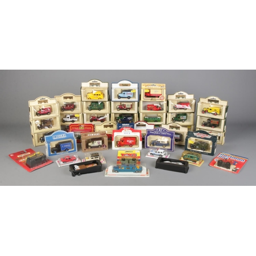 355 - A large collection of boxed die cast vehicles, to include Lledo Days Gone By, Cameo and Corgi.