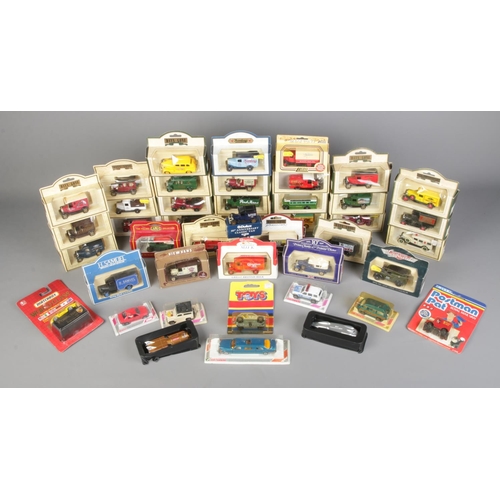 355 - A large collection of boxed die cast vehicles, to include Lledo Days Gone By, Cameo and Corgi.