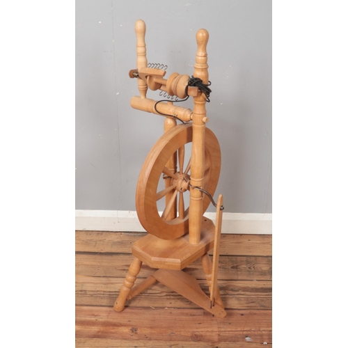 361 - A modern pine spinning wheel.