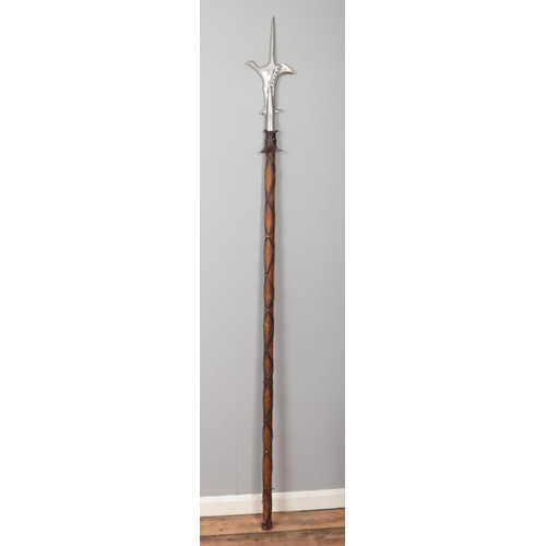 365 - A halberd with leather wrapped handle. (220cm)