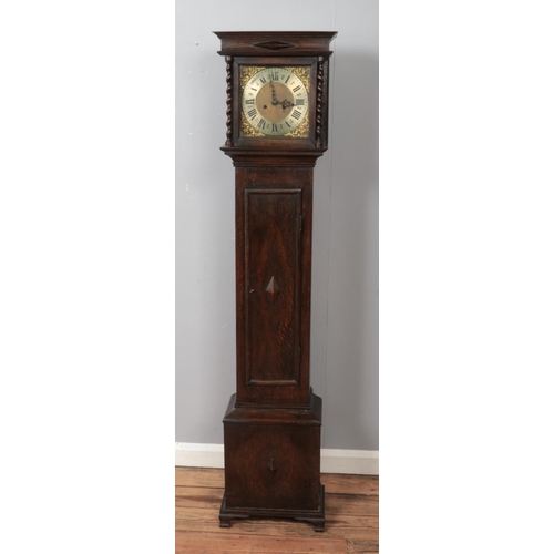 369 - A John Mason of Rotherham oak longcase clock decorated with cherub scrollwork motifs and roman numer... 