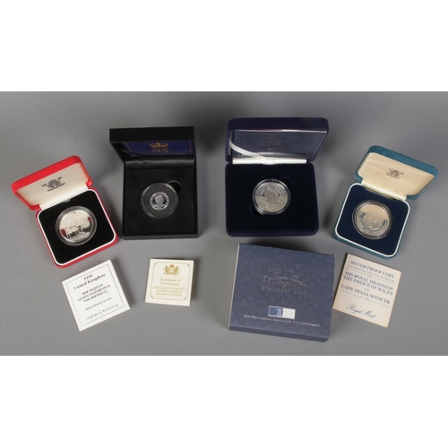 459 - Four cased Royal Mint silver coins. Includes Queen Elizabeth The Queen Mother Centenary Year Crown, ... 