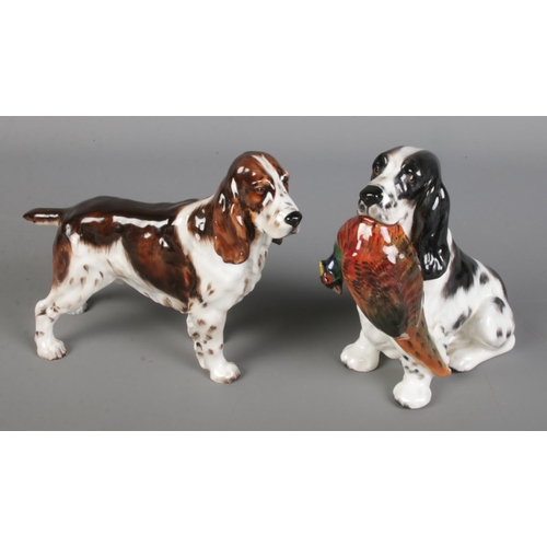 465 - Two Royal Doulton Springer Spaniel dogs. Includes example holding dead pheasant.