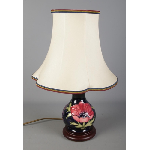 478 - A Moorcroft blue ground anemone pattern table lamp with shade. Approx. height without shade 20cm.