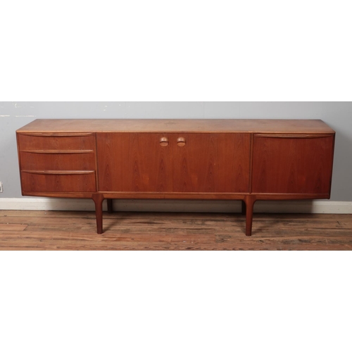 503 - An A H McIntosh & Company teak sideboard, with arrangement of three drawers, two central cupboard do... 