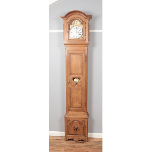 513 - A 19th century French oak cased Comtoise clock.