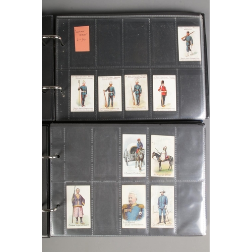 519 - Two folders of incomplete cigarette cards including Modern Armaments, Cairo 