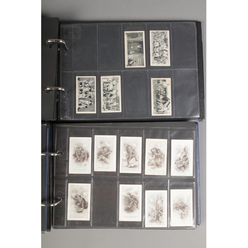 519 - Two folders of incomplete cigarette cards including Modern Armaments, Cairo 