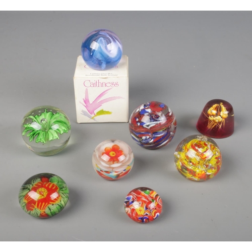 289 - A collection of glass paper weights with one resin example and one boxed Caithness paperweight