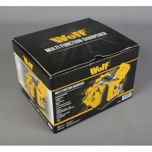 294 - A Wolf multi function sharpener in box