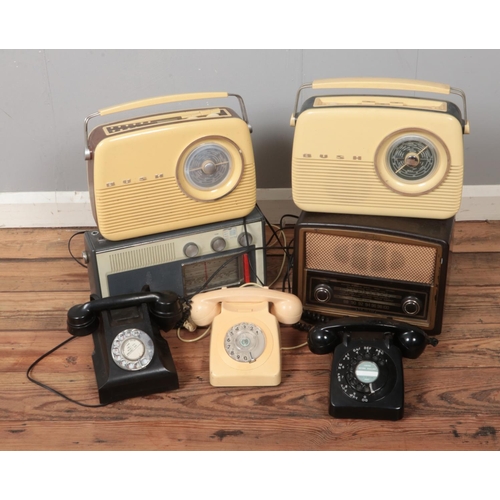 336 - A quantity of vintage radios including Bush example along with three bakelite telephones.