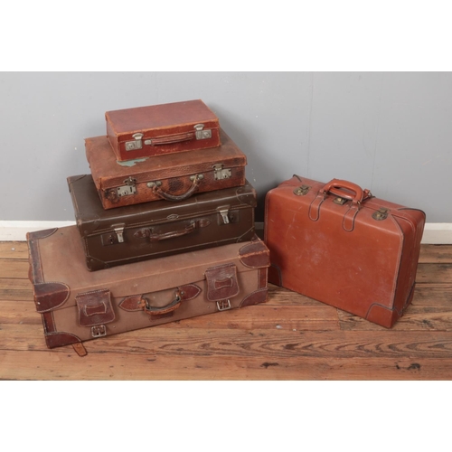 371 - A selection of five vintage suitcases including a Superslat example.