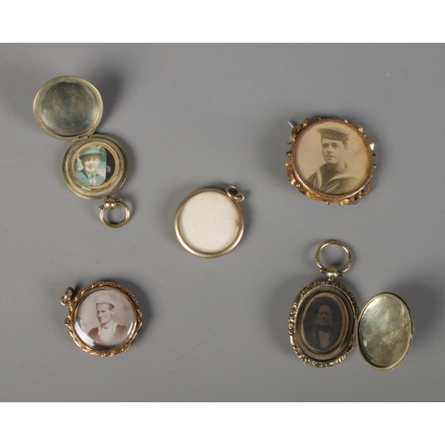 430 - A selection of five lockets including military example.