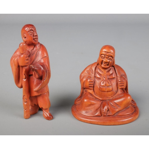 448 - Two hand carved hardwood Buddha netsukes.