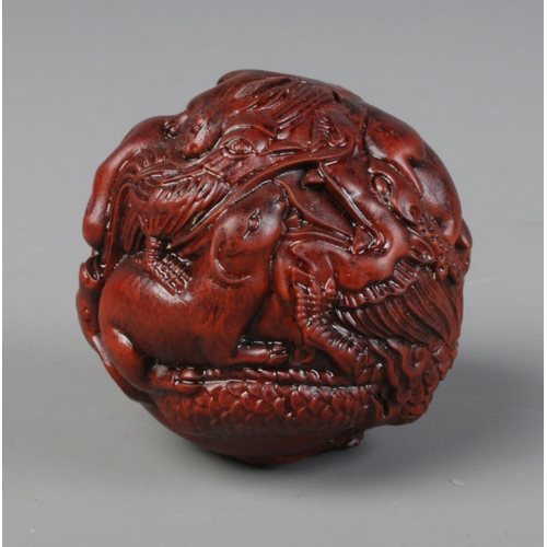 449 - A spherical shaped netsuke. Depicting the 12 animals of the Chinese Zodiac.