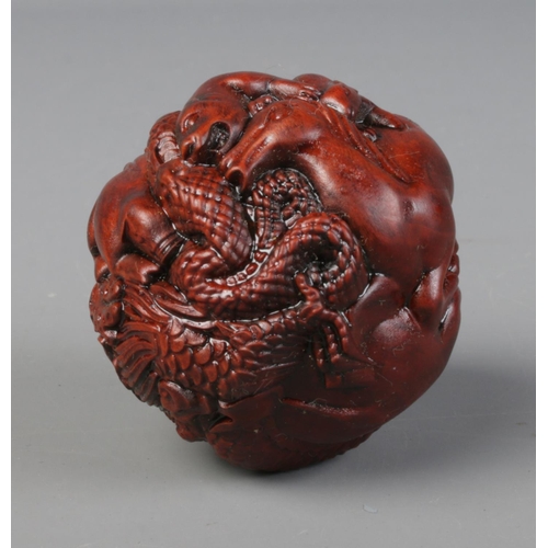 449 - A spherical shaped netsuke. Depicting the 12 animals of the Chinese Zodiac.