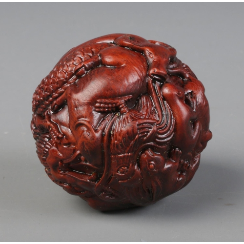 449 - A spherical shaped netsuke. Depicting the 12 animals of the Chinese Zodiac.