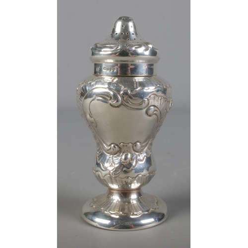 482 - An embossed silver sugar castor, B Muller & Son 1894, 92g.