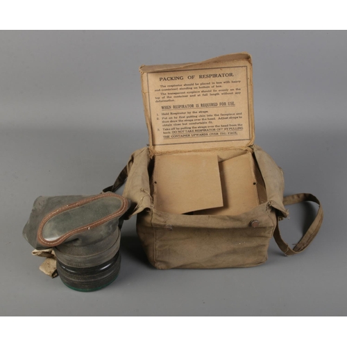 74 - World War II civilian issue respirator in original Canvas and cardboard box