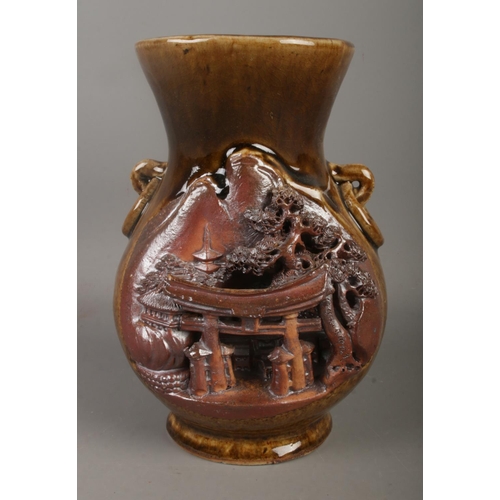 12 - A Japanese stoneware vase decorated with temple landscape scene. Stamped Made in Japan with seal mar... 