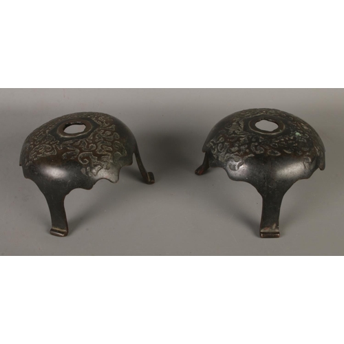 60 - A pair of bronze sword/rapier cup shaped cross guards.