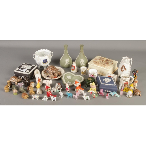 63 - A collection of ceramics and glass animals. Includes Wedgwood Jaserware, Masons, Wade whimsies, cres... 