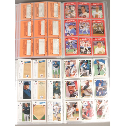 73 - Two full albums of mostly 1990s baseball cards. Includes Topps, Upper Deck, Impel, Score, Nolan Ryan... 