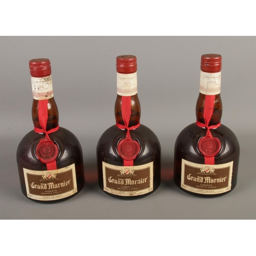 93 - Three full and sealed bottles of Grand Marnier orange and cognac liqueur.