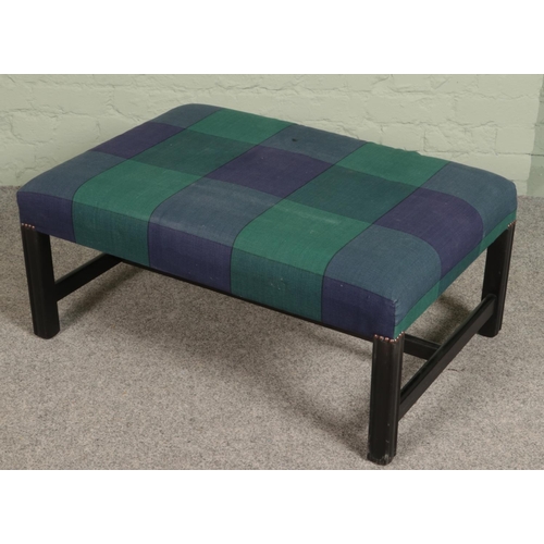 399 - A blue & green checkered upholstered footstool.