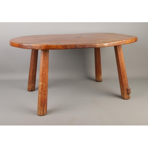 400 - Colin Almack, Beaverman; a kidney shaped oak four legged occasional table/stool, with octagonal supp... 