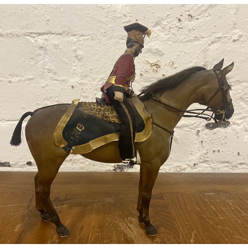 13 - An antique composite figure formed as a military soldier on horseback, base stamped 16th Lancers 183... 