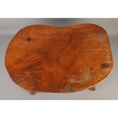 430 - Colin Almack, Beaverman; a kidney shaped oak four legged occasional table/stool, with octagonal supp... 