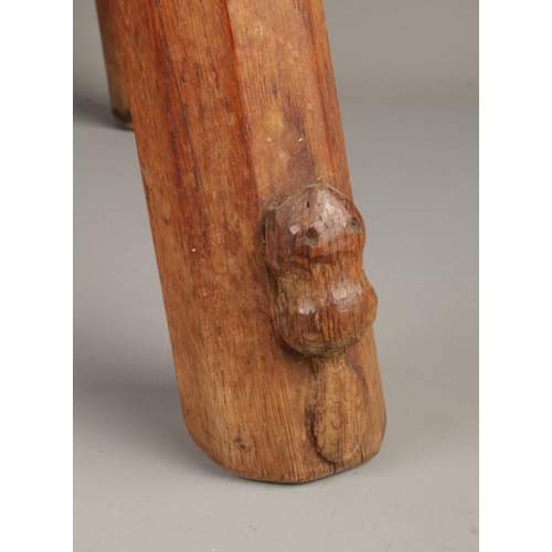 430 - Colin Almack, Beaverman; a kidney shaped oak four legged occasional table/stool, with octagonal supp... 