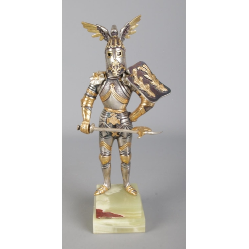 38 - A Gippe Vasani figure of a medieval knight with removable helmet. Approx. 27cm tall. Stamped 145/400... 