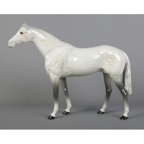 408 - A large Beswick horse in dapple grey, model 1564. Height 28cm.