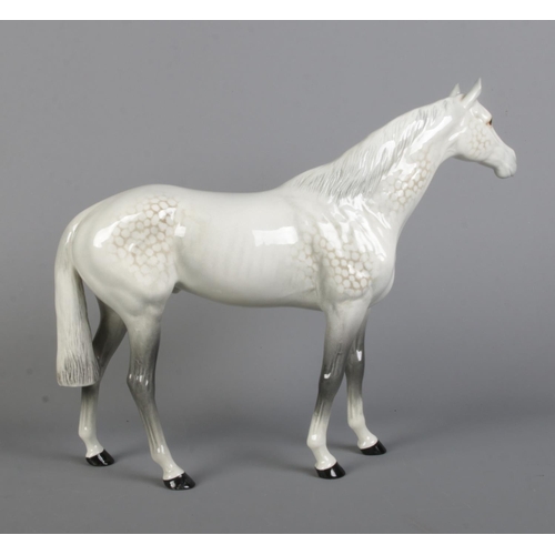 408 - A large Beswick horse in dapple grey, model 1564. Height 28cm.