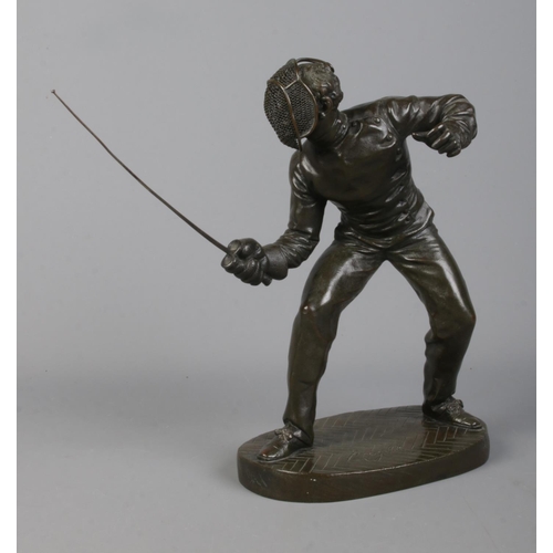 113 - After Benedict B Rougelet, a pair of bronze fencers, signed F Lombard. Height 28cm.