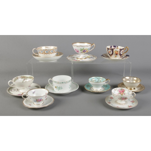 105 - Nine cups and saucer sets. To include handpainted, Dresden Floral, Heinrich Fanny Gibler and Ackerma... 