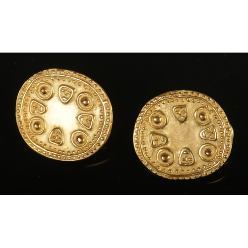 375 - A pair of yellow metal earrings formed ancient style coins. Total weight 8.34g.