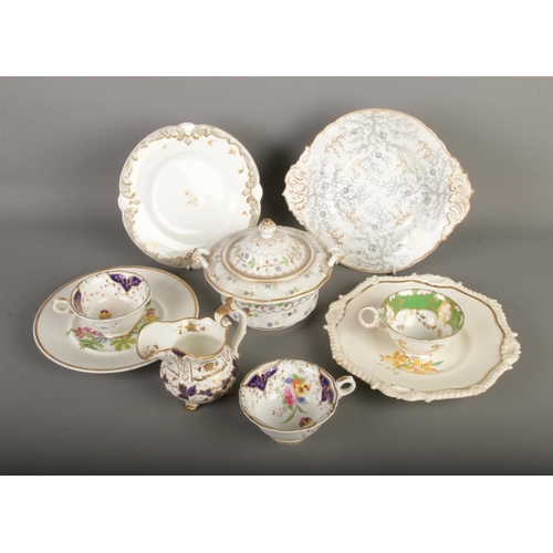 111 - A collection of Rockingham and similar ceramics to include milk jug, teacups, plates, etc. One plate... 