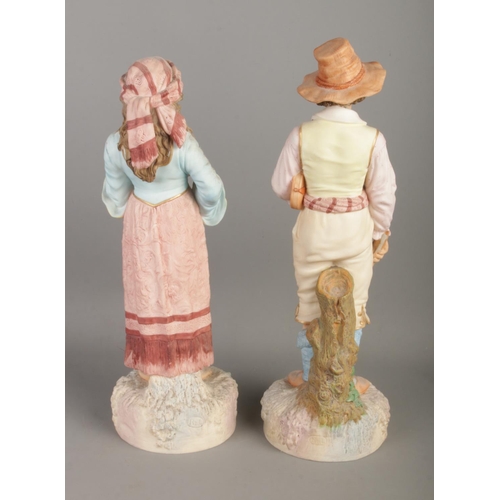 112 - A pair of Robinson and Leadbeater ceramics figures formed as musicians, one with violin and one with... 