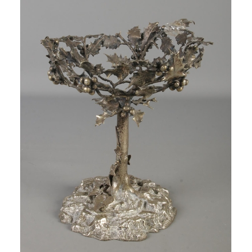 10 - A silver plated pedestal bowl decorated with vines. Height 24cm.
