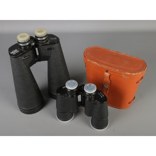 101 - A pair of Hans Weiss Optik 15 x 80 Field 3.5 binoculars with another cased set of 10x50 binoculars