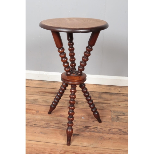 453 - A mahogany Gypsy table with bobbin turn supports.