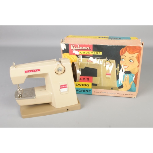 115 - A vintage Vulcan Countess child's sewing machine in original box.