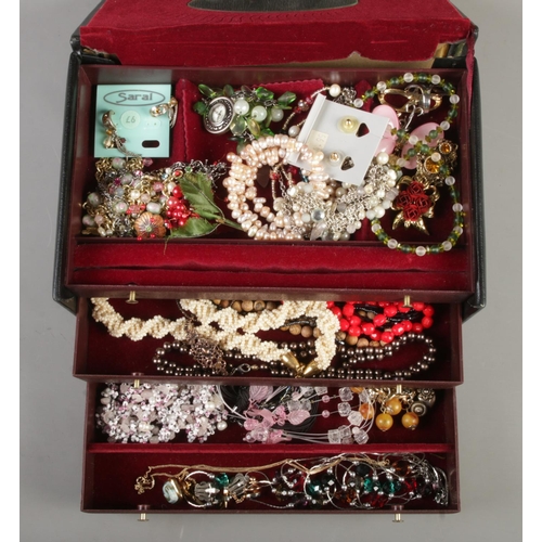 12 - Two jewellery boxes containing costume jewellery, including one with pull out drawers, together with... 