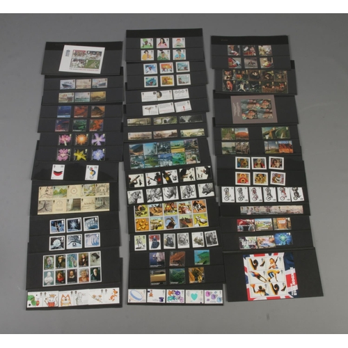 128 - A good collection of unfranked, unused Royal Mail commemorative stamp sets. Examples include London ... 